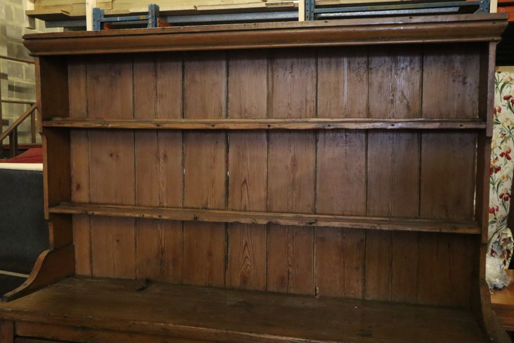 A late 18th century stripped pine dresser, width 182cm depth 50cm height 202cm